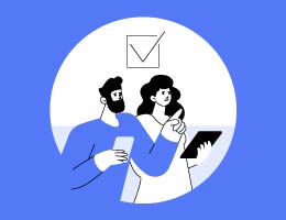 Two people at a doctor’s visit together, one asking a question, the other with a tablet for taking notes.