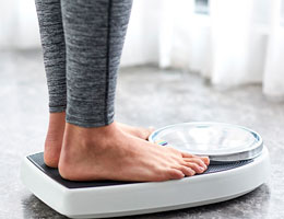  A woman's feet on a bathroom scale