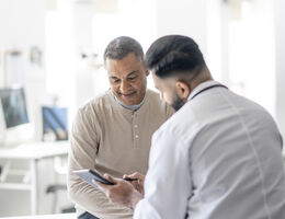 A man talking to a doctor.