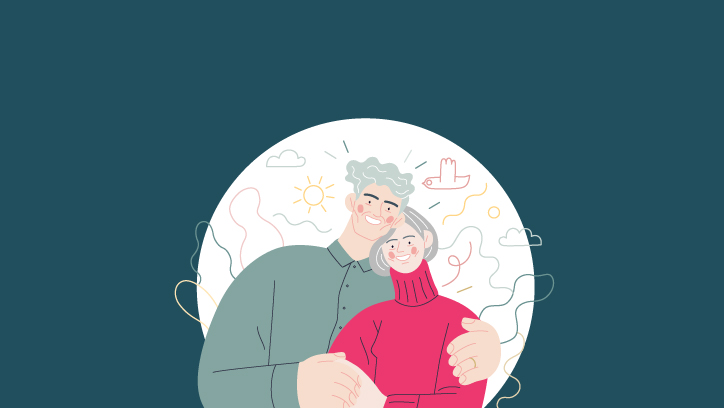 An older couple hugging. 