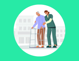 A caregiver walks behind and steadies a man using a walker.