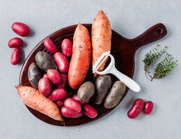 A variety of colorful potatoes grouped together.