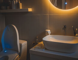 A bathroom lit by night-lights.