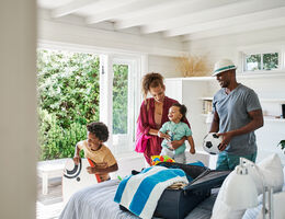 A family unpacking their beach toys.