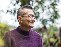 A smiling older man.